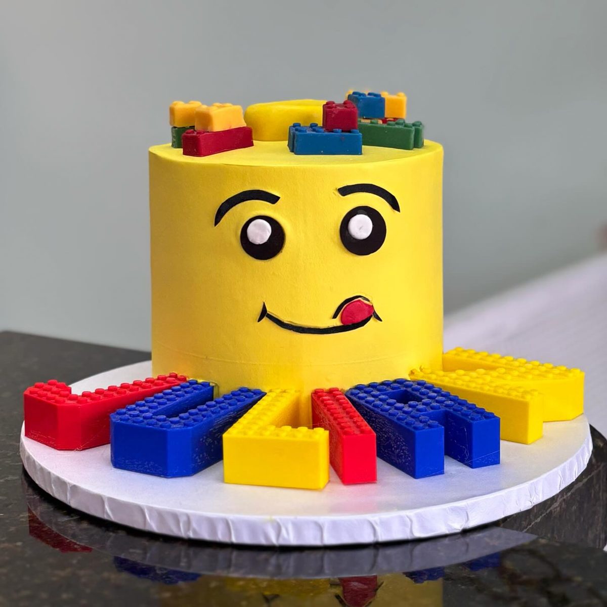 Yellow Smiling Face Cake with Building Blocks from Tarzana Bakery