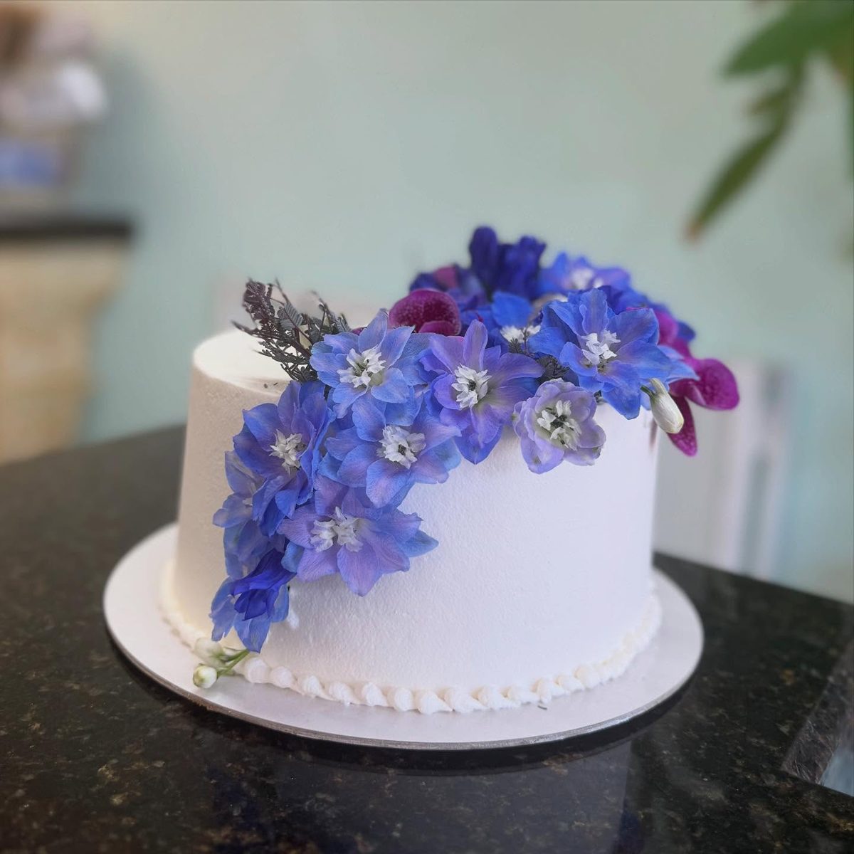 White Cake With Cascading Purple Flowers from Tarzana Bakery