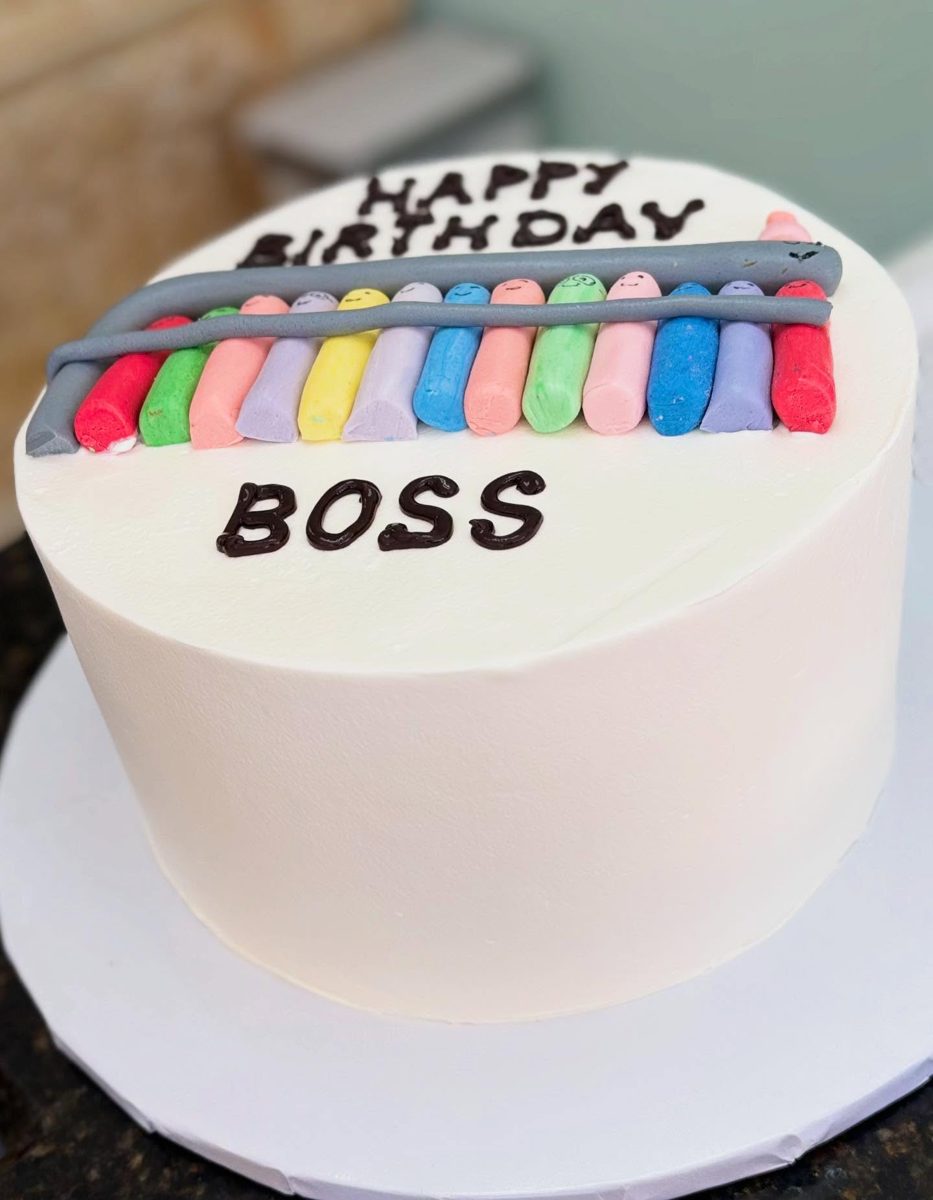 White Cake With Colorful Smiling Figures from Tarzana Bakery